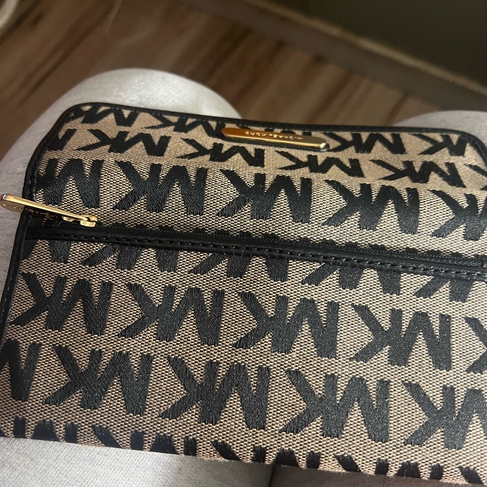 Michael Kors, wallet , black and tan very good condition